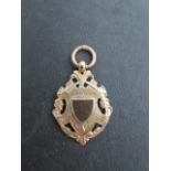 A hallmarked 9ct yellow gold fob medallion, approx 7 grams