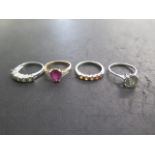 Four 9ct gold rings, sizes N, approx 10.6 grams (three white gold and one yellow gold), all good