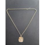 A hallmarked 9ct yellow gold St Christopher on a hallmarked 53cm chain, approx 10.4 grams in