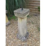 A stone effect sun dial, 98cm tall