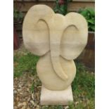 A stylised limestone elephant sculpture, hand carved by a Cambridgeshire based stone carver, 55cm