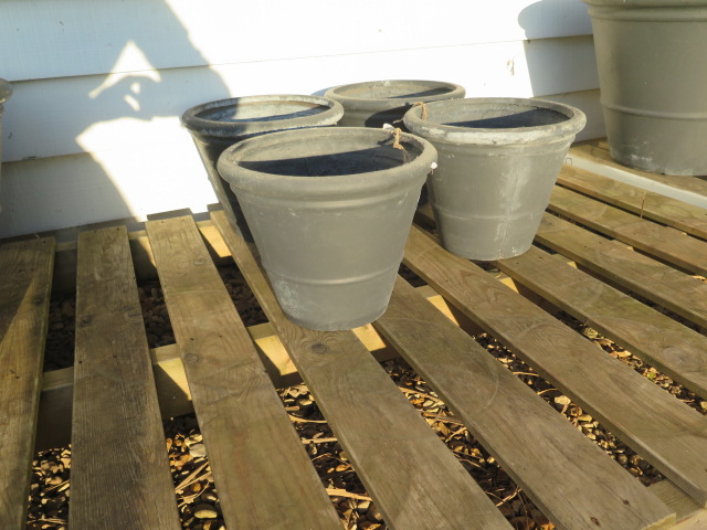 Four small grey frost proof plant pots 30 cm diameter