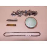 A silver charm bracelet, a silver chain, a silver compact and a cheroot holder with 9ct band in a