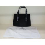 An Escada black suede handbag with pink lining, 31cm wide, in good condition with outer bag