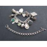 A silver charm bracelet and a silver chain bracelet, 18cm long, total weight approx 4 troy oz