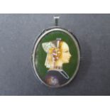 A framed white metal miniature hand painted portrait brooch pendant, signed to left, 5cm x 3cm