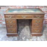A late Victorian / Edwardian oak 9 drawer twin pedestal desk with a leather insert top, 75cm tall
