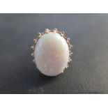 A hallmarked 9ct gold opal ring, size K/L, the opal approx 20mm x 16mm, total weight approx 6 grams,