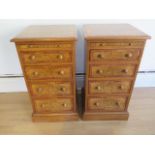 A pair of burr oak bedside four drawer chests each with a slide made by a local craftsman to a