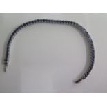 A 9ct white gold blue stone bracelet, marked 9K, 18cm long, approx 10.8 grams, in good condition