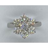 A good 18ct white gold hallmarked 7 stone diamond cluster ring, each stone approx 0.40ct with the