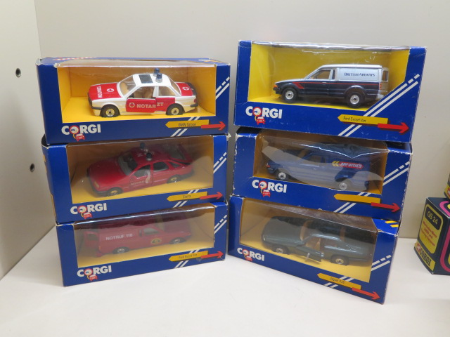 Two boxed Noturzt and Notruf Corgi cars and a van and three other vehicles all boxed, boxes have