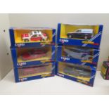 Two boxed Noturzt and Notruf Corgi cars and a van and three other vehicles all boxed, boxes have