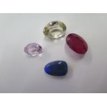 Four unmounted stones, largest approx 12mm x 16mm x 9mm, possibly moonstone or opal, ruby quartz and