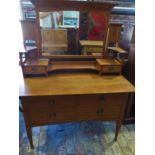 An Art Nouveau Oak Liberty style dressing table Rgd No 380496 with stylized inlay and heart shaped