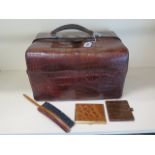 A late Victorian / Edwardian crocodile Gladstone type case with a crocodile wallet and card case and