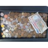 A collection of assorted World banknotes and coins