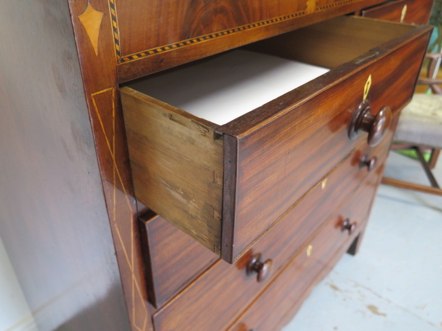 A 19th century mahogany five drawer chest with an inlaid frieze on bracket feet united by a shaped - Image 5 of 6