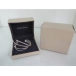 A Georg Jensen sterling silver Alliance bangle, 7.5cm wide external, boxed and in good condition,