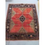 A hand knotted woollen Hamadan rug, 1.90m x 1.53m, in good condition