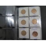 An album of Portugal coins, four sets of coins, one Escudo 1969-1979, 44 coins in total