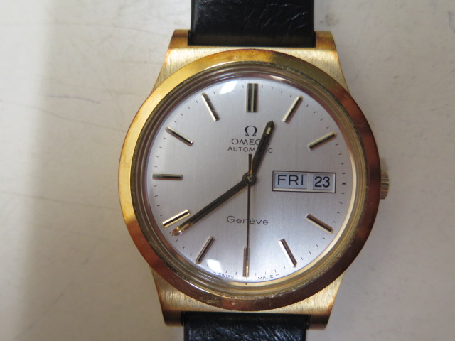 An Omega Automatic Geneve date gold plated gents wristwatch on a black leather strap, 36mm case,