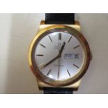 An Omega Automatic Geneve date gold plated gents wristwatch on a black leather strap, 36mm case,