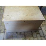 A 19th Century stripped pine storage box 50 cm tall 93 by 55 cm