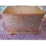 A 19th Century Mahogany chest of drawers with a brushing slide above four drawers on bracket feet 87