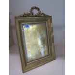 A good quality ormulu bronze easel back photograph frame, 37cm tall x 25cm wide, some small dents to