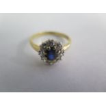 An 18ct yellow gold diamond and blue sapphire cluster ring, head size 10mm x 12mm, size R/S,