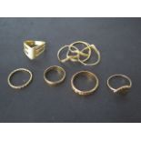 Five 18ct yellow gold rings and a puzzle ring not marked but tests to approx 18ct, total weight