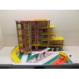 A Toy Works garage mulit-story car park with lift and car wash, pumps and a set of Esso pumps,