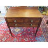 A 19th Century Mahogany side table with two short drawers over a single long drawer on turned reeded