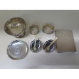 A pair of Continental silver salts, two silver napkin rings (one damaged), a silver bowl, coin