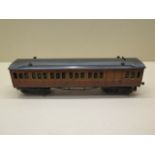 A Hornby 0 gauge tinplate 1920s Metropolitan Line 3rd class Brake Coach with lighting, reasonably