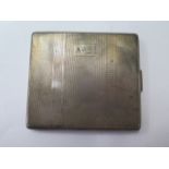 A silver cigarette case, approx 4.2 troy oz, engraved but good condition