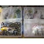 Three trays of assorted jewellery making beads and fittings with a tray of made necklaces