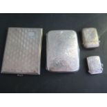 Two silver vestas and two silver cigarette cases, total weight approx 8.3 troy oz, all good apart