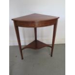 An Edwardian inlaid rosewood corner table with an undertier