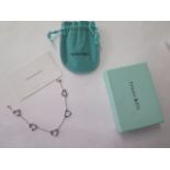 A Tiffany & Co Elsa Peretti silver open heart bracelet, 17cm long, with box and bag in good