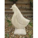 A carved stone limestone chicken, hand carved by a Cambridgeshire based stone carver, 53cm tall x
