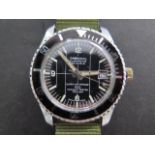 A Cardinal Submarine 23 jewel manual wind wristwatch with date and rotating bezel, 38mm case on a