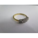 An 18ct hallmarked yellow gold five stone diamond ring, size N/O, approx 2.8 grams, in good