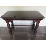 A Victorian black slate top mahogany serving table with two frieze drawers, one stamped Gillows