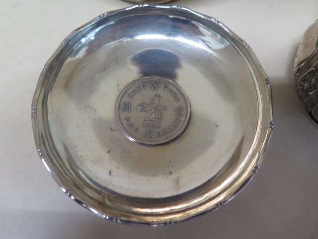 A pair of Continental silver salts, two silver napkin rings (one damaged), a silver bowl, coin - Image 2 of 4