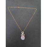 An 18ct yellow gold opal and diamond pendant on a 45cm chain, both marked 750, pendant is approx