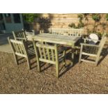 A Barlow Tyrie garden table , bench and four armchairs in nicely weathered condition , table 70 cm