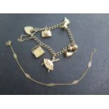 A 9ct gold charm bracelet approx 15.7 grams, generally good and an 18ct bracelet, 19cm long,