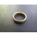 A hallmarked 22ct yellow gold band ring, size J/K, approx 7.3 grams, some usage marks otherwise good